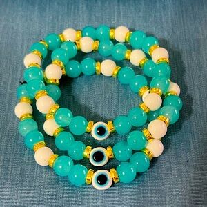 Blue evil eye, white and blue teal glass bead bracelet